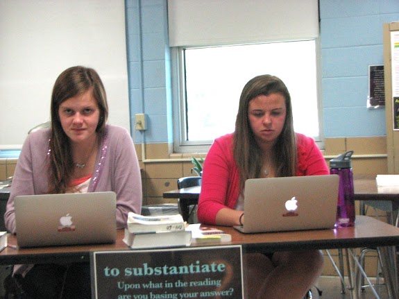 Seniors Moriah Cooper and Jessica Harvey use their laptops in class