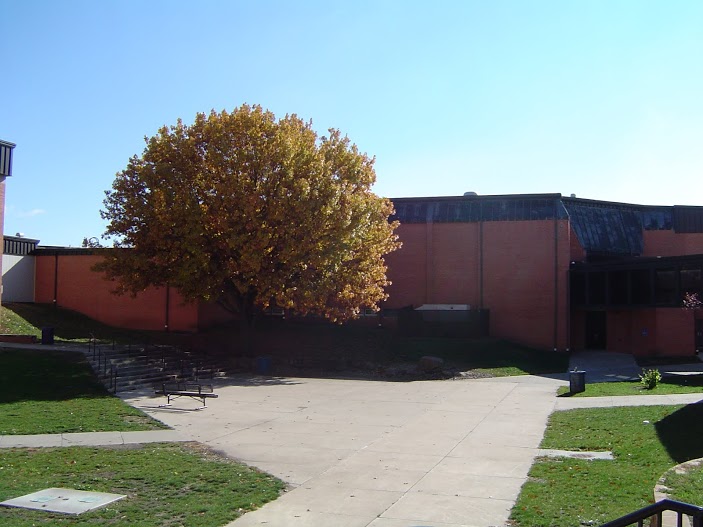 The courtyard stands empty on a sunny day.