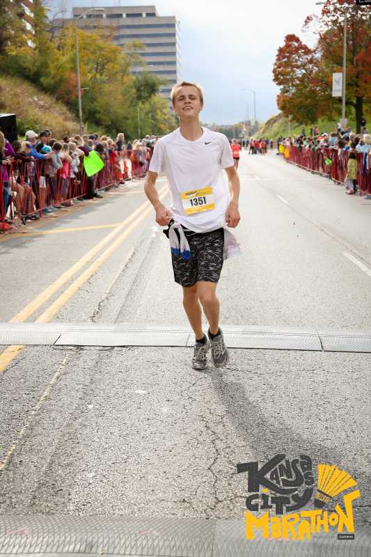 Michael Holm crosses the finish line at 4 hours and 50 minutes.