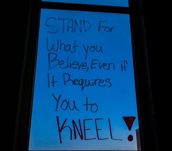 Image of messages written on the windows for Black History Month.