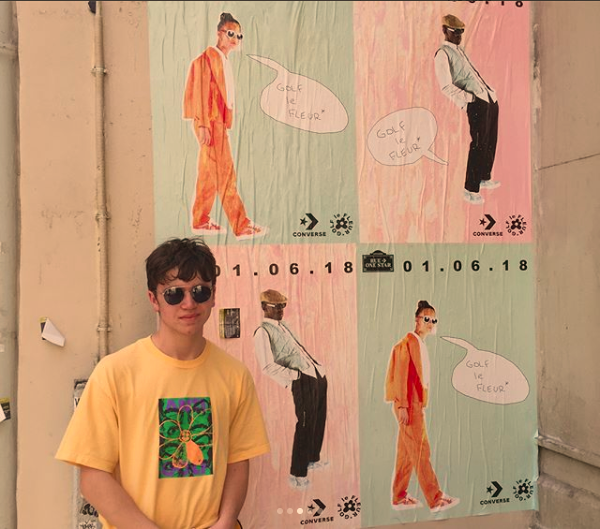 Michael poses for a photo near the Converse store in Paris.