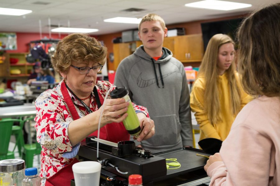 FCS teacher Carol Vanwaardhuizen instructs foods students on how to make pancakes. 