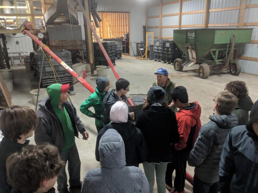 Students involved in Ames high garden club learn about grain production at Early Morning Harvest in Panora, Iowa.