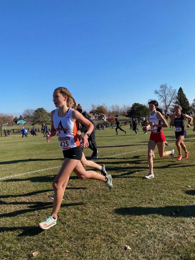 Pictured here: Sophomore Sydney Turk racing in her second mile