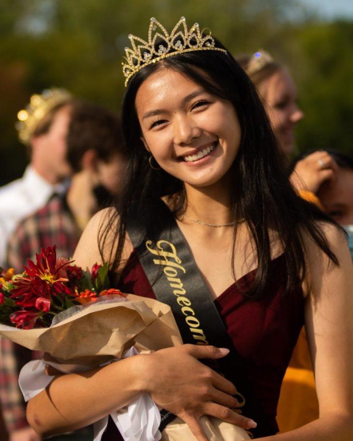 Ling+Bai+poses+with+her+flowers+after+being+awarded+homecoming+queen.+