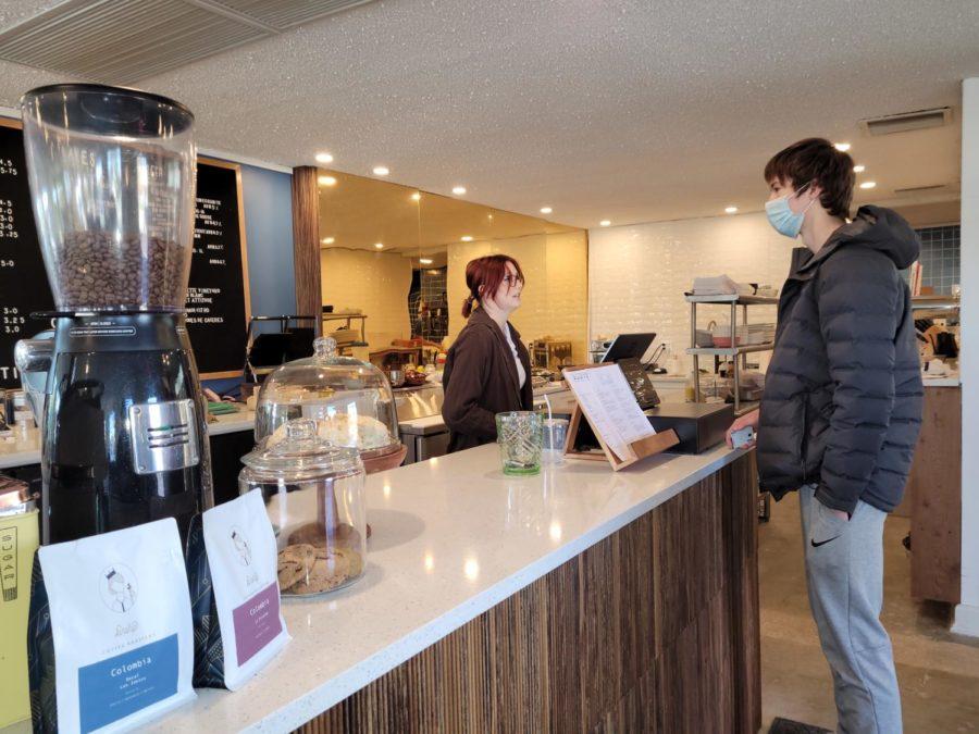 Bennett Anderson orders his Lavendar Matcha drink at the counter. 