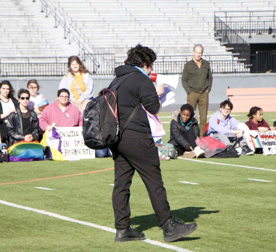 Senior Zack Pinto speaks to students on the football field during the March 1st Ames High walkout. 