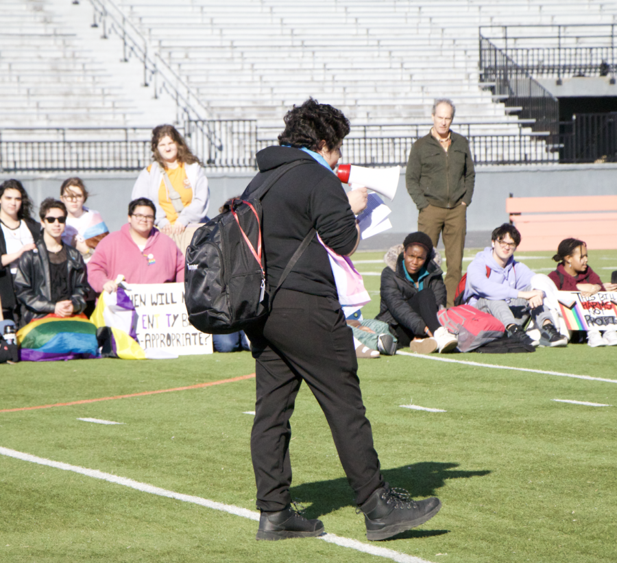 Senior+Zack+Pinto+speaks+to+students+on+the+football+field+during+the+March+1st+Ames+High+walkout.+