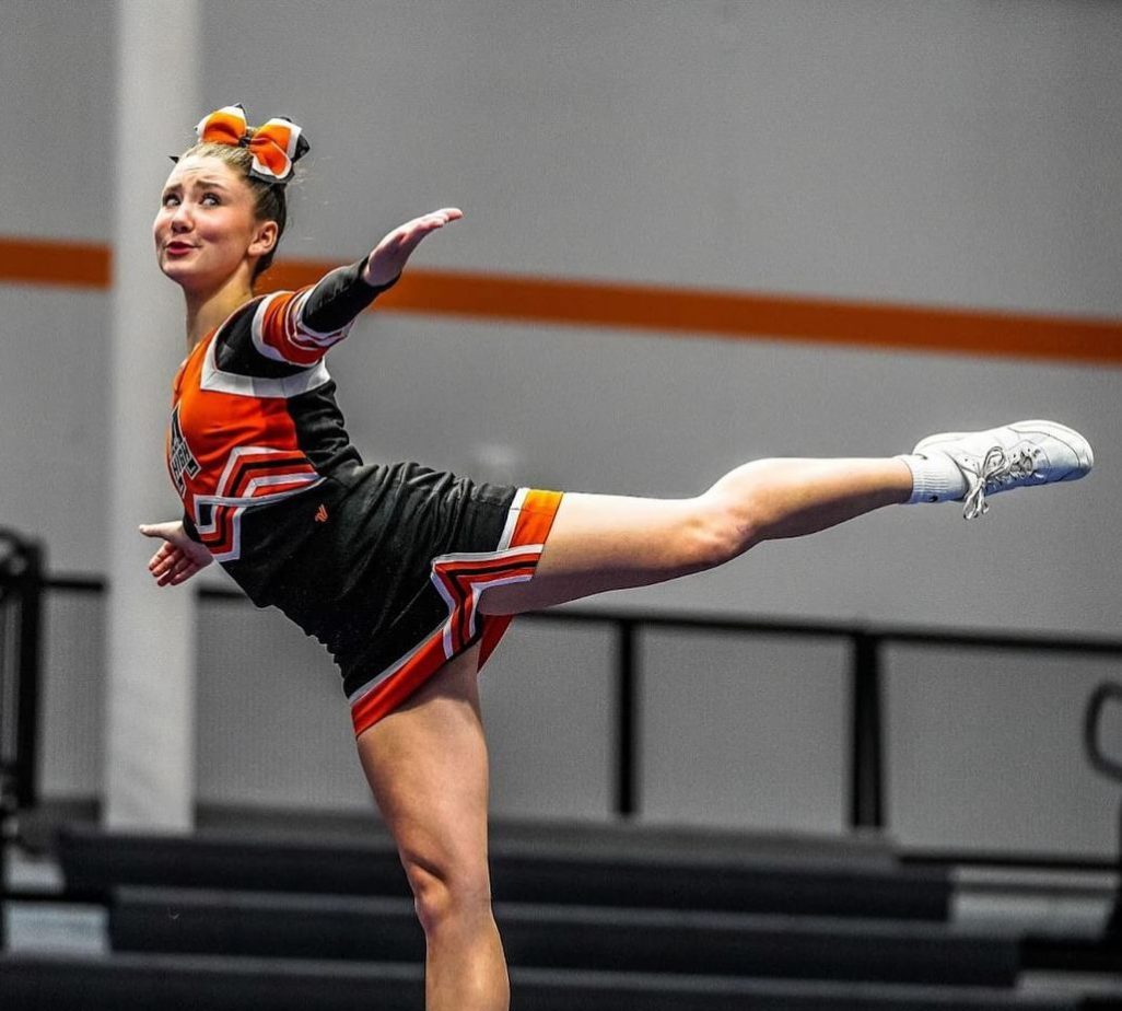 Sylvie McConnell showing off her skills at the fall cheer showcase before her state performance. Photo by Ryan Renger.