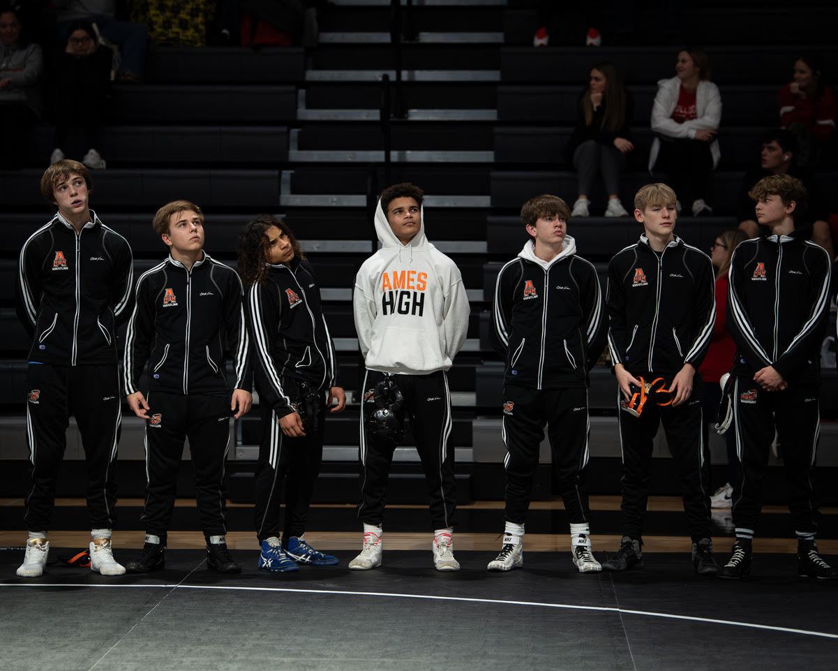 Jabari Hinson (middle) stands with his teammates before a tournament—photo by Adam Atkinson.