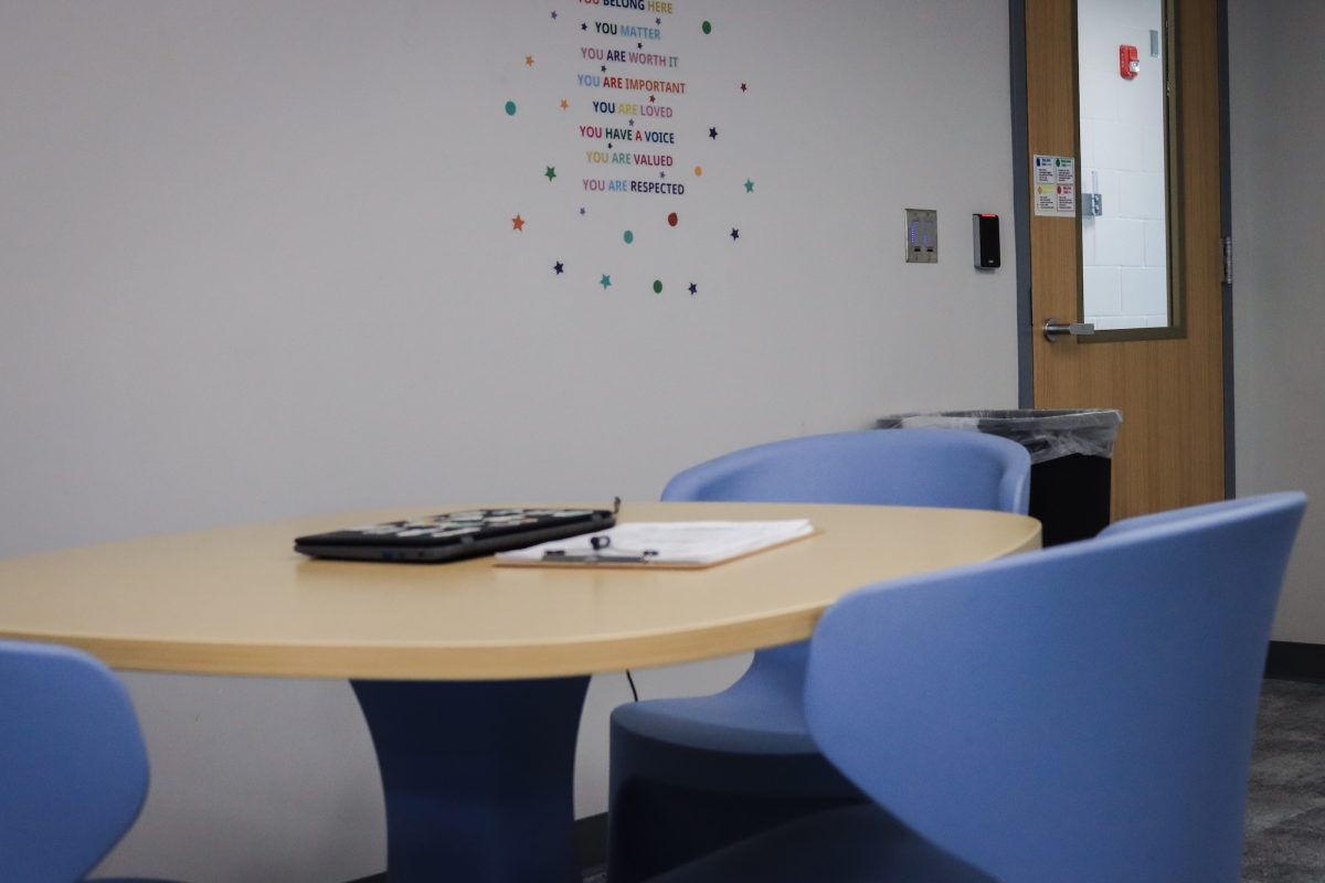 A desk in one of the AMES Center's therapeutic classrooms. The chairs are made of plastic and extremely heavy, one of the room's features meant to foster a safer learning environment for the students it serves. 