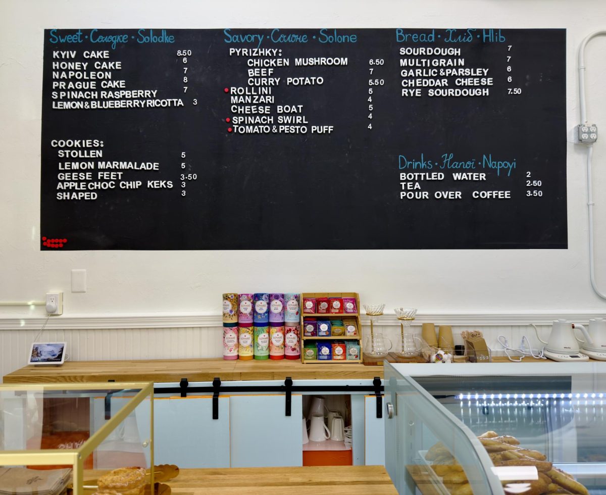 Piece and Freedom Bakery's menu hangs above the store's front counter. The bakery aims to bring a taste of Ukraine to Ames.