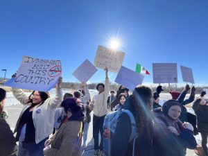 Students holding up signs at the walkout